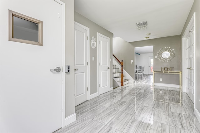 104 W Maple Ave, Monsey, NY 10952 - entrance foyer with baseboards and stairs