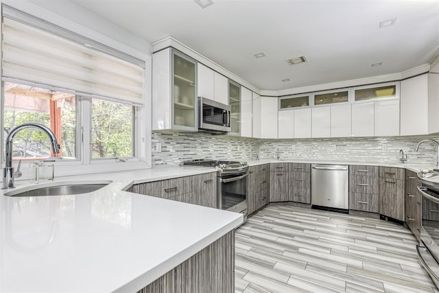 104 W Maple Ave, Monsey, NY 10952 - kitchen with a sink, appliances with stainless steel finishes, and modern cabinets
