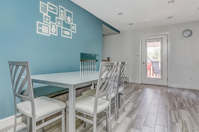 104 W Maple Ave, Monsey, NY 10952 - dining area featuring baseboards, a baseboard heating unit, and wood finish floors