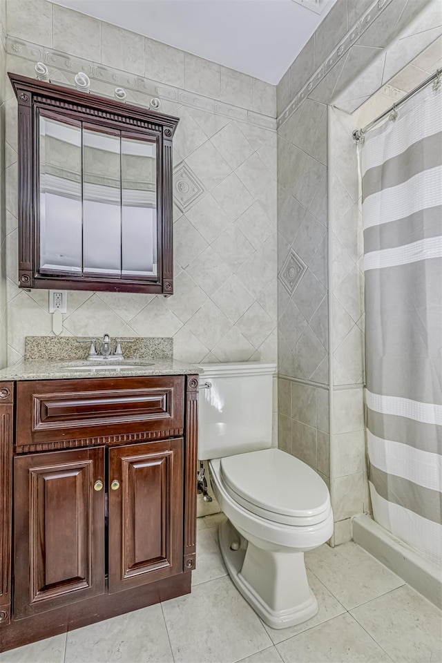 104 W Maple Ave, Monsey, NY 10952 - full bath featuring vanity, tile patterned flooring, a stall shower, and toilet