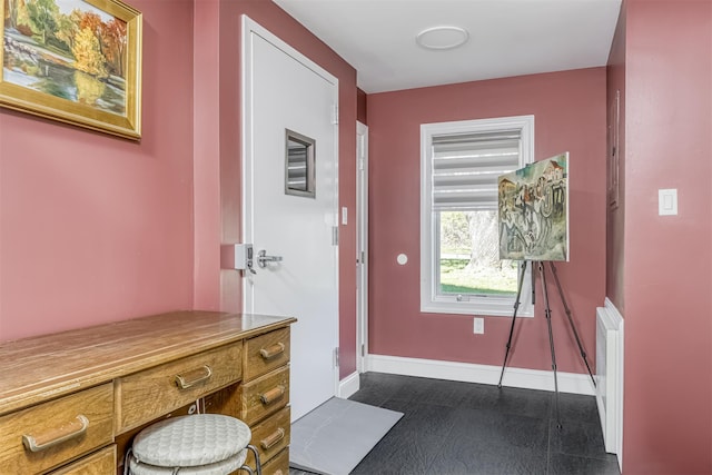 104 W Maple Ave, Monsey, NY 10952 - doorway featuring baseboards and radiator heating unit