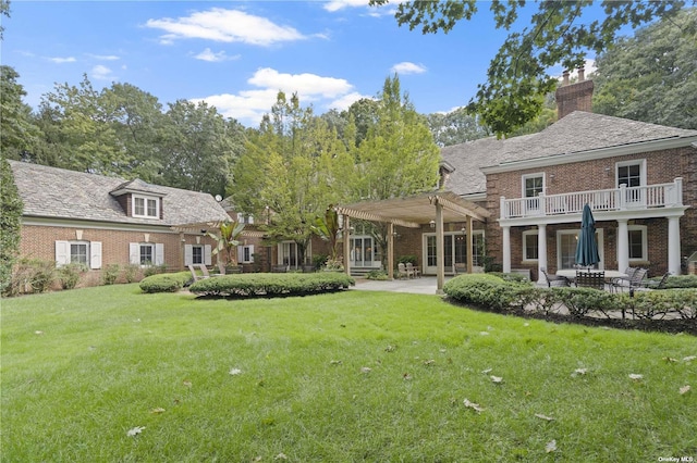 822 Bryant Ave, Roslyn Harbor, NY 11576 - back of house featuring brick siding, a pergola, a chimney, and a patio
