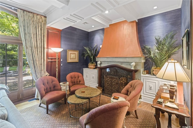 822 Bryant Ave, Roslyn Harbor, NY 11576 - sitting room featuring wood finished floors, beamed ceiling, a premium fireplace, ornamental molding, and a wealth of natural light