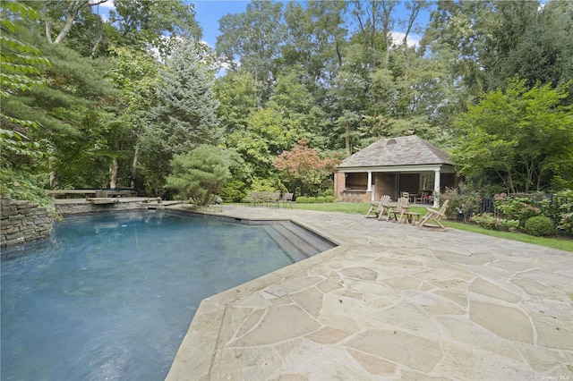 822 Bryant Ave, Roslyn Harbor, NY 11576 - outdoor pool with fence, an outbuilding, an exterior structure, and a patio area