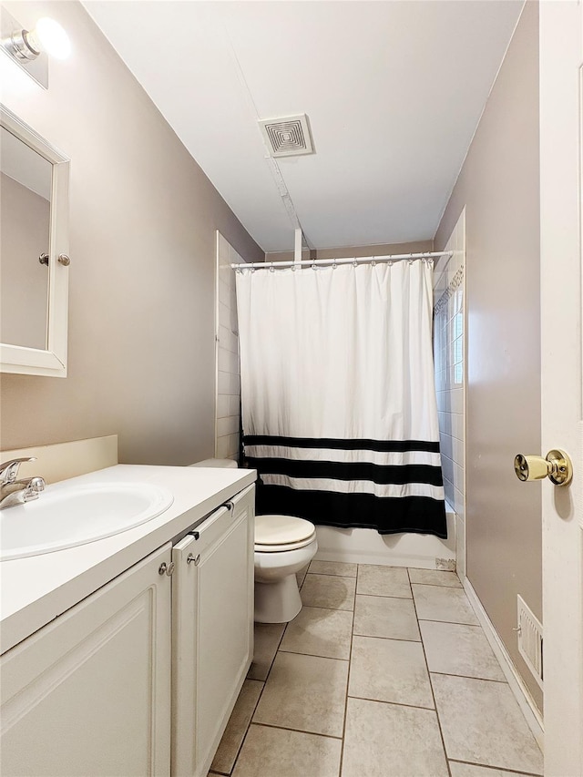 bathroom featuring visible vents, shower / tub combo with curtain, toilet, and vanity