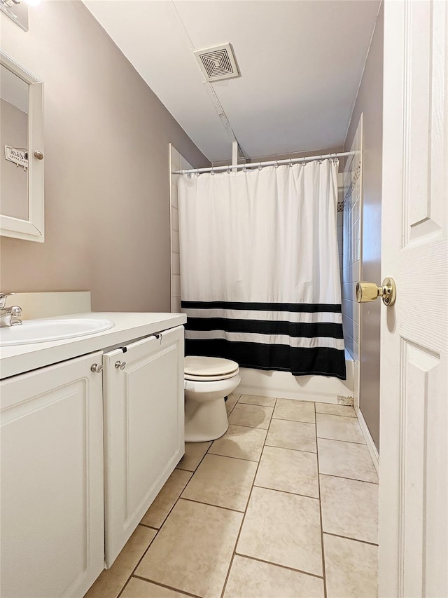 bathroom with visible vents, shower / bath combo with shower curtain, tile patterned flooring, vanity, and toilet