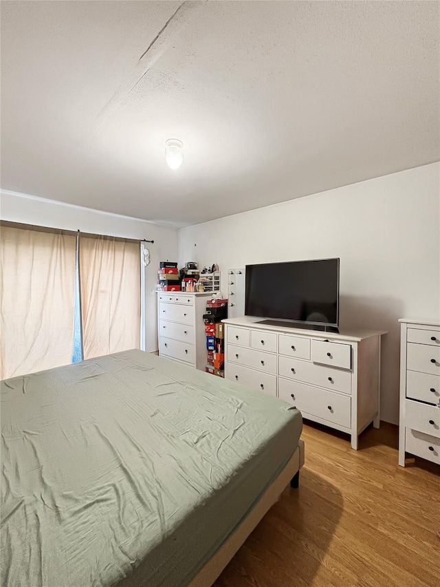 bedroom featuring light wood-type flooring