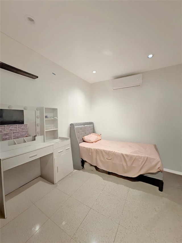 bedroom featuring recessed lighting, baseboards, and a wall unit AC