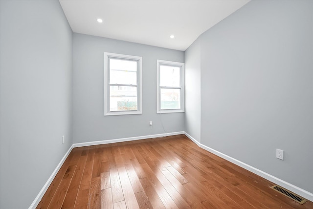 955 Crescent St, Brooklyn, NY 11208 - spare room with baseboards, hardwood / wood-style flooring, and visible vents