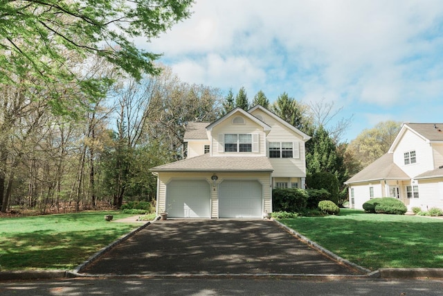 3 Cloister Ln, Middle Island, NY 11953 - view of front of house featuring an attached garage, driveway, and a front yard