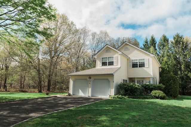 3 Cloister Ln, Middle Island, NY 11953 - traditional home featuring an attached garage, driveway, and a front lawn