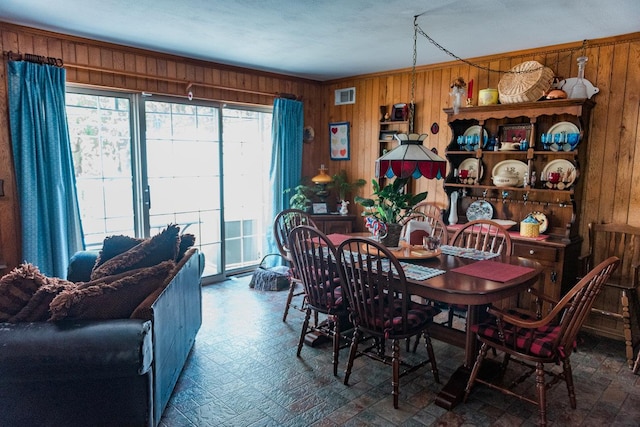 3 Cloister Ln, Middle Island, NY 11953 - dining area with visible vents, wood walls, and a wealth of natural light
