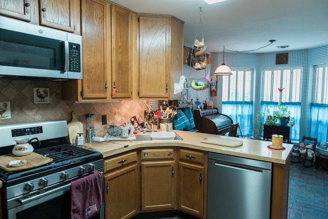 3 Cloister Ln, Middle Island, NY 11953 - kitchen with light countertops, decorative backsplash, stainless steel appliances, and a peninsula