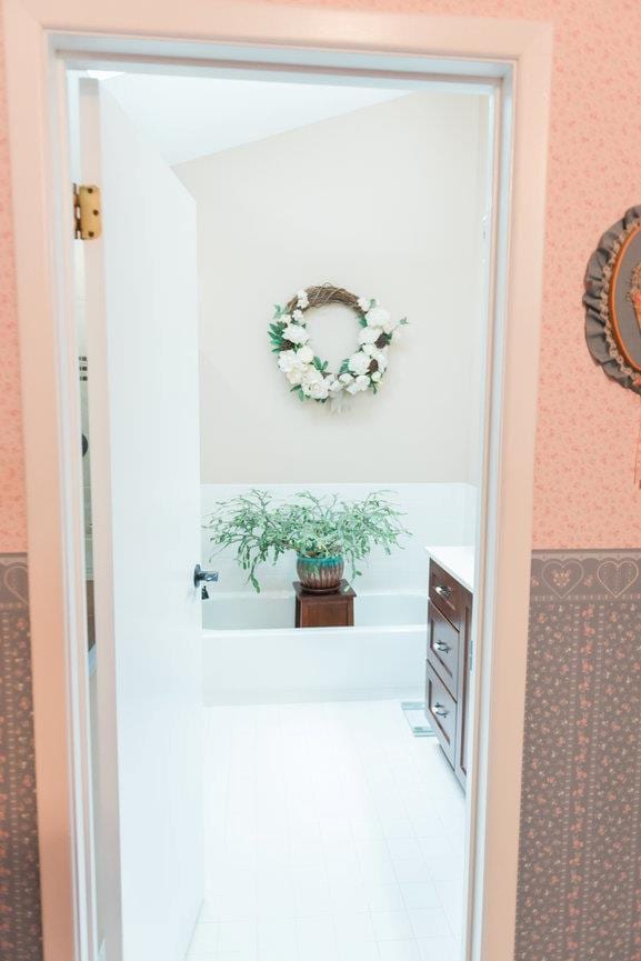 3 Cloister Ln, Middle Island, NY 11953 - interior space with vanity, a bath, and wallpapered walls