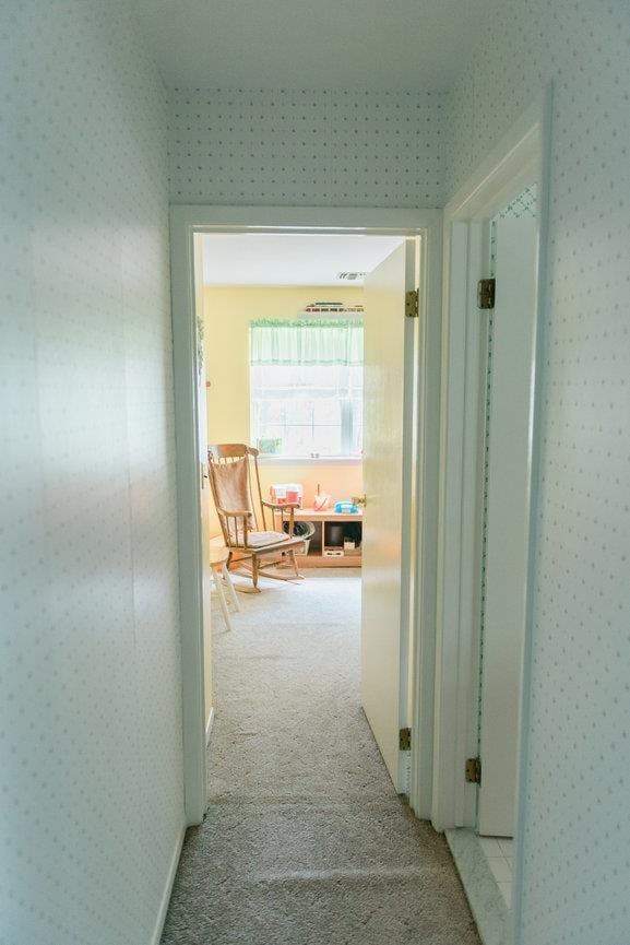 3 Cloister Ln, Middle Island, NY 11953 - hall featuring wallpapered walls and light carpet