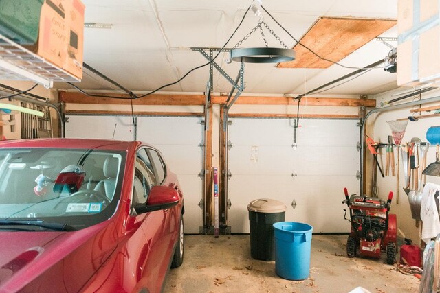 3 Cloister Ln, Middle Island, NY 11953 - garage with a garage door opener
