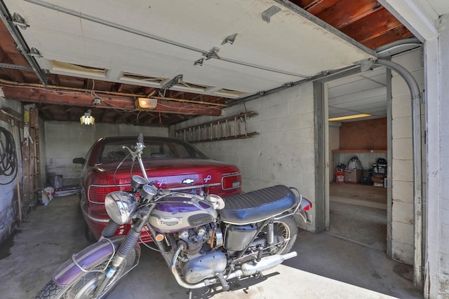 57 Harth Dr, New Windsor, NY 12553 - garage with a garage door opener and concrete block wall