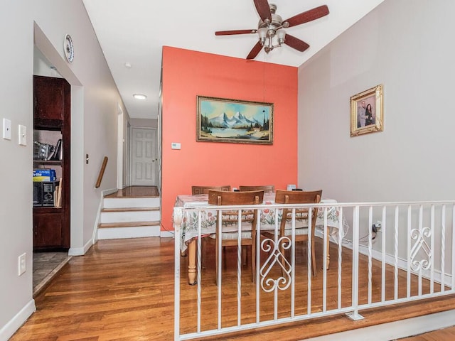 314 Mclean Ave, Yonkers, NY 10705 - dining room with ceiling fan, wood finished floors, stairway, baseboards, and recessed lighting