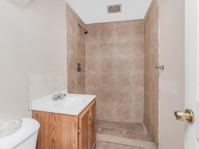 314 Mclean Ave, Yonkers, NY 10705 - bathroom featuring toilet, visible vents, a tile shower, and vanity