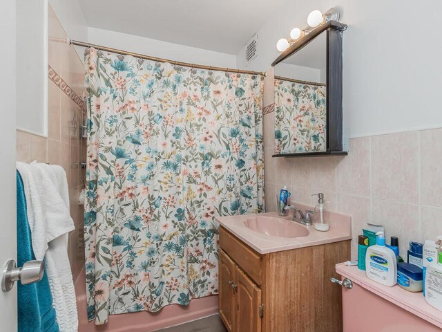 314 Mclean Ave, Yonkers, NY 10705 - full bath with vanity, shower / bath combination with curtain, tile walls, decorative backsplash, and visible vents