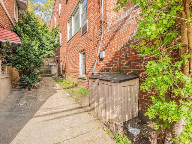 314 Mclean Ave, Yonkers, NY 10705 - view of side of property featuring brick siding and a shed
