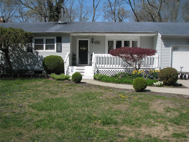 20 Clover St, Mastic, NY 11950 - view of front of house with a shingled roof, covered porch, and a front yard