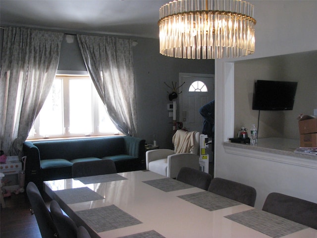 20 Clover St, Mastic, NY 11950 - dining room with wood finished floors and a chandelier