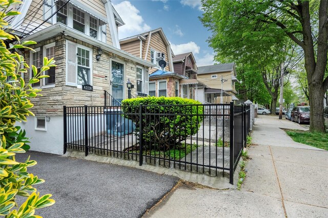 4220 Wickham Ave, Bronx, NY 10466 - view of front of home with fence private yard and stone siding