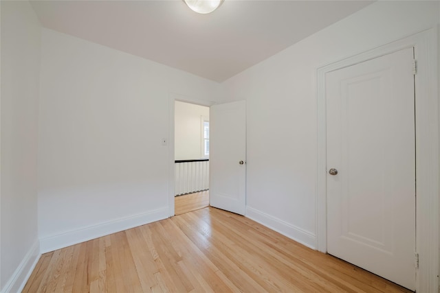 4220 Wickham Ave, Bronx, NY 10466 - unfurnished bedroom featuring light wood-style floors and baseboards