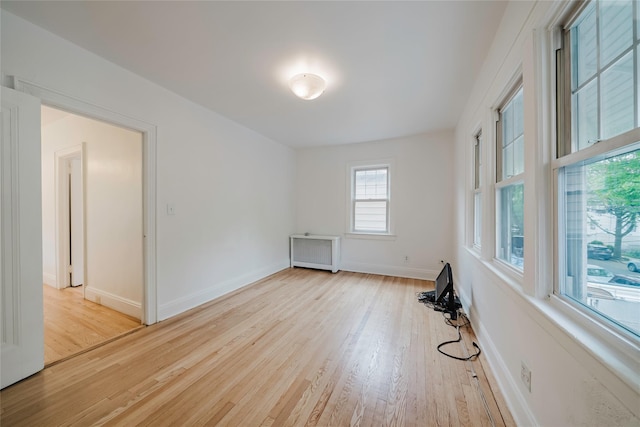 4220 Wickham Ave, Bronx, NY 10466 - spare room with baseboards, radiator, and wood finished floors