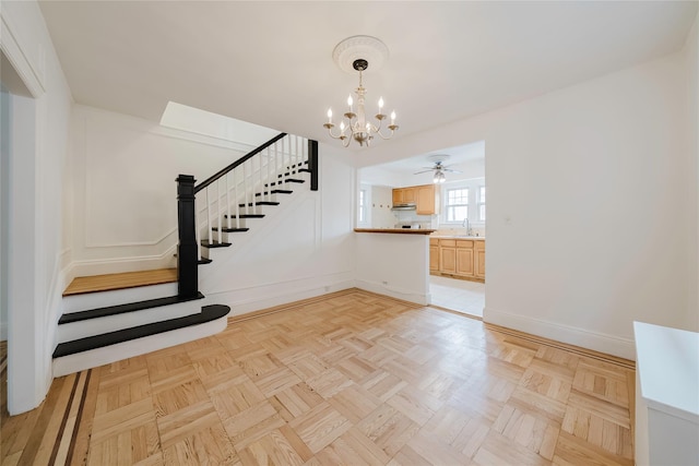 4220 Wickham Ave, Bronx, NY 10466 - interior space featuring baseboards, stairs, and ceiling fan with notable chandelier