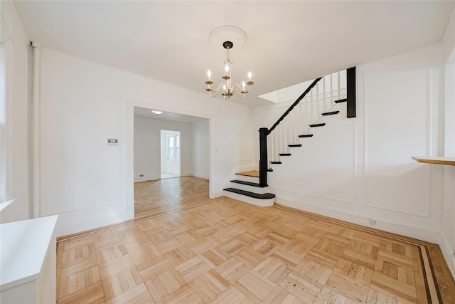 4220 Wickham Ave, Bronx, NY 10466 - interior space featuring baseboards, stairs, and a chandelier