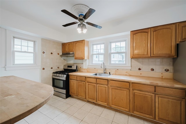 4220 Wickham Ave, Bronx, NY 10466 - kitchen featuring plenty of natural light, a sink, under cabinet range hood, and gas range