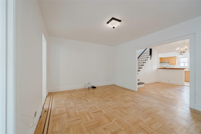 4220 Wickham Ave, Bronx, NY 10466 - spare room with an inviting chandelier, baseboards, and stairs