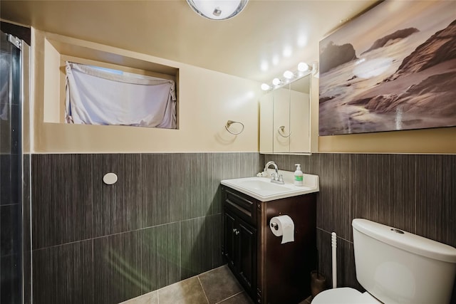 4220 Wickham Ave, Bronx, NY 10466 - bathroom with vanity, wainscoting, tile patterned floors, and toilet