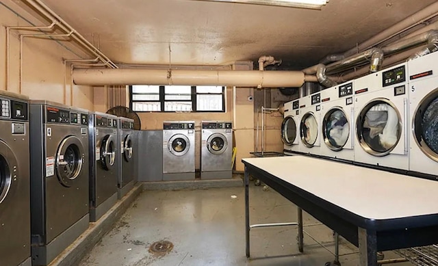 community laundry room featuring washing machine and clothes dryer