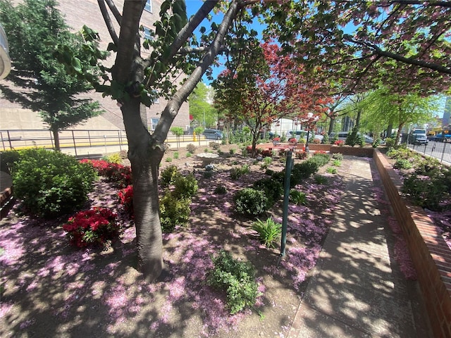view of community with fence
