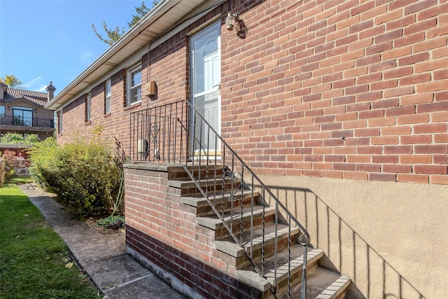 view of side of property featuring brick siding