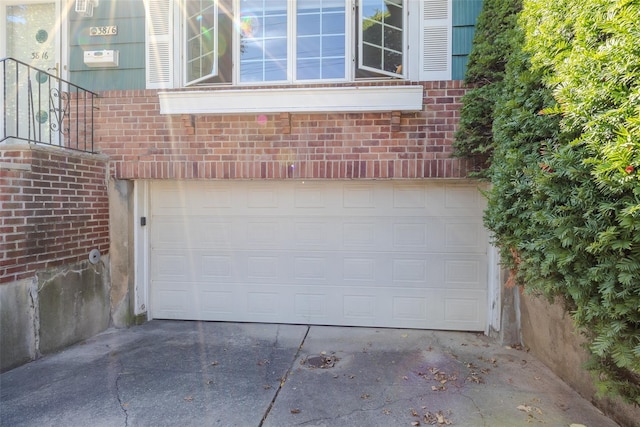 garage featuring driveway