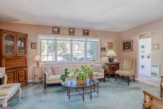 living area featuring carpet floors and radiator heating unit