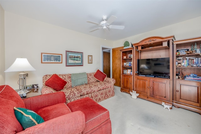 living room featuring carpet floors and ceiling fan