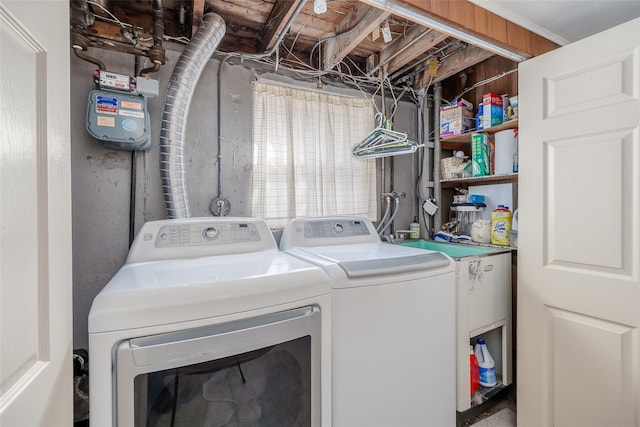 clothes washing area with laundry area and washing machine and clothes dryer