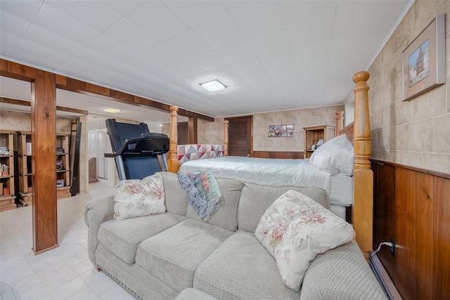 bedroom with wooden walls