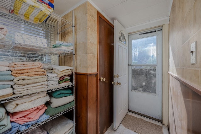 doorway to outside featuring tile patterned flooring