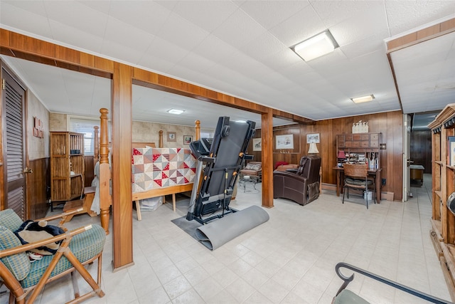 exercise room featuring wooden walls
