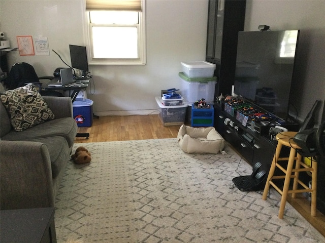 268-03 83rd Ave Fl 2Nd, Floral Park, NY 11040 - living room featuring baseboards and wood finished floors