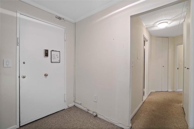 100 High Point Dr Unit 504, Hartsdale, NY 10530 - hall featuring light carpet, ornamental molding, a textured ceiling, and baseboards
