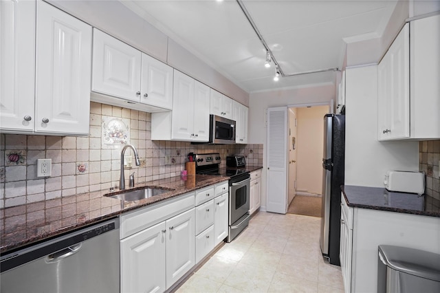 100 High Point Dr Unit 504, Hartsdale, NY 10530 - kitchen featuring stainless steel appliances, a sink, white cabinetry, dark stone countertops, and backsplash