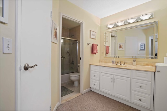 100 High Point Dr Unit 504, Hartsdale, NY 10530 - full bathroom with vanity, toilet, bath / shower combo with glass door, and baseboards