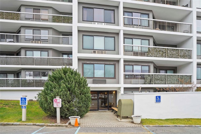 100 High Point Dr Unit 504, Hartsdale, NY 10530 - view of apartment building / complex featuring uncovered parking